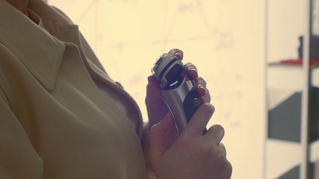 Video Reference: Hand, Sleeve, Gesture, Wood, Photographer, Camera, Camera lens, Finger, Eyewear, Thumb