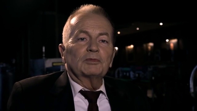 Video Reference: Forehead, Chin, Tie, Dress shirt, Collar, Suit, Spokesperson, Blazer, Official, Formal wear