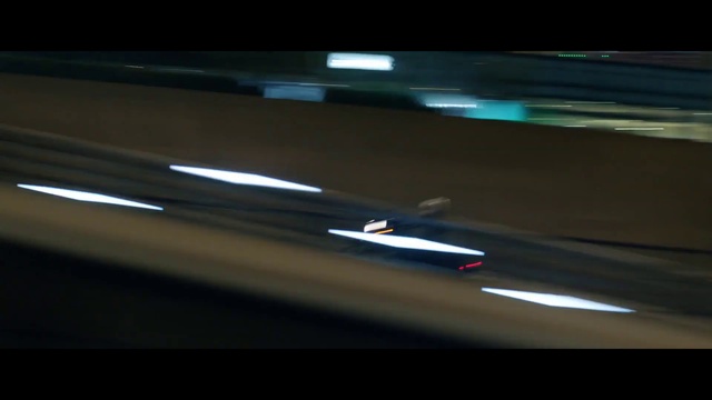 Video Reference: Automotive lighting, Automotive design, Automotive exterior, Font, Tints and shades, Electronic device, Auto part, Darkness, Electric blue, Display device