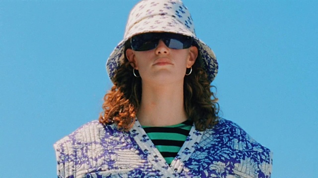 Video Reference: Clothing, Face, Glasses, Hair, Head, Lip, Shoulder, Vision care, Sunglasses, Cap