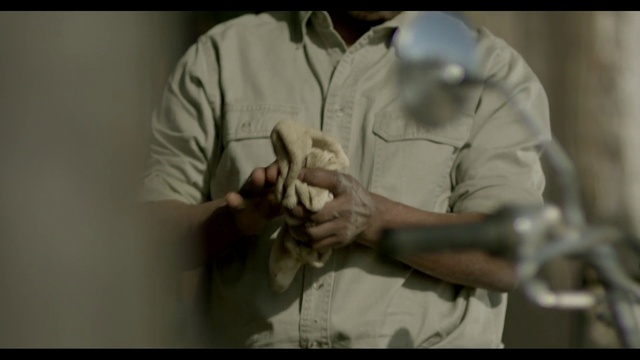 Video Reference: Sleeve, Gesture, Elbow, Dress shirt, Science, Thumb, Uniform, Safety glove, Event, Wrist