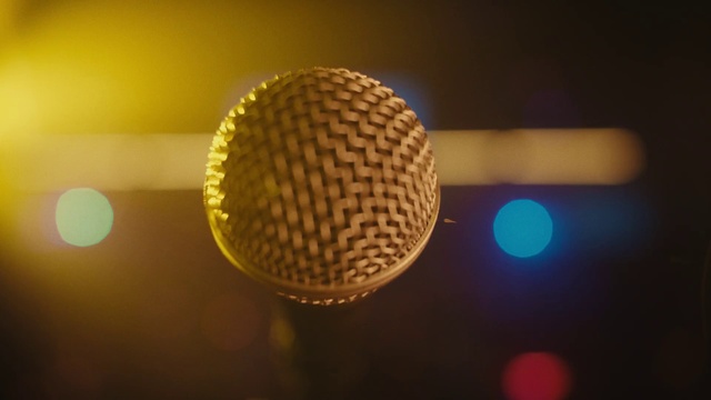 Video Reference: Light, Amber, Lamp, Microphone, Tints and shades, Circle, Audio equipment, Pattern, Ceiling, Metal