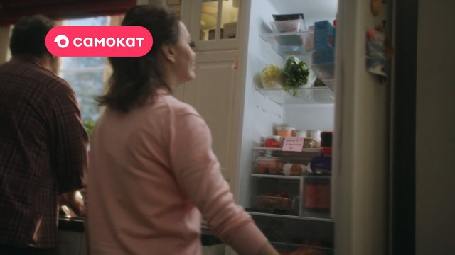 Video Reference: kitchen, refrigerator, people, food, interior, home, open fridge, groceries, cooking, family, logo overlay, indoor
