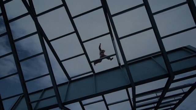 Video Reference: person, jumping, falling, roof, glass ceiling, steel frame, architecture, sky, silhouette, low angle, action, urban
