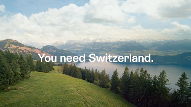 Video Reference: Switzerland, mountains, lake, forest, hills, snowy peaks, clouds, sky, landscape, nature, scenic, panorama, valley, grassland, text overlay