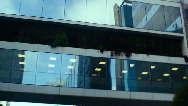 Video Reference: Building, Shade, Rectangle, Facade, Tints and shades, Glass, Fixture, Commercial building, Transparent material, Composite material