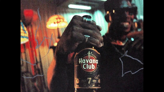 Video Reference: Sleeve, Font, Alcoholic beverage, Drink, Electronic device, Bottle, Root beer, Poster, Display device, Distilled beverage