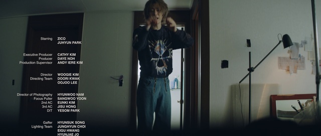 Video Reference: Jeans, Shoulder, Flash photography, Sleeve, Microphone, Waist, Grey, Musical instrument, Elbow, Denim