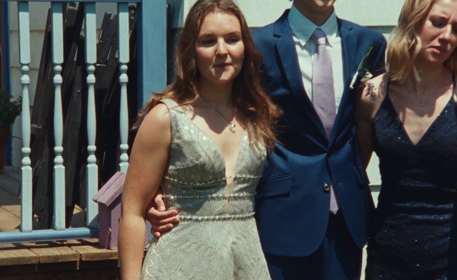 Video Reference: Hair, Face, Smile, Dress, Flash photography, Happy, Gesture, Tie, Gown, Formal wear