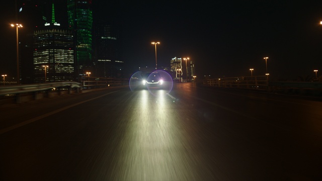 Video Reference: Automotive lighting, Car, Vehicle, Road surface, Building, Street light, Asphalt, Mode of transport, Headlamp, Electricity