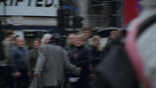 Video Reference: Motor vehicle, Event, City, Road, Hat, Pedestrian, Crowd, Street, Building, Fun