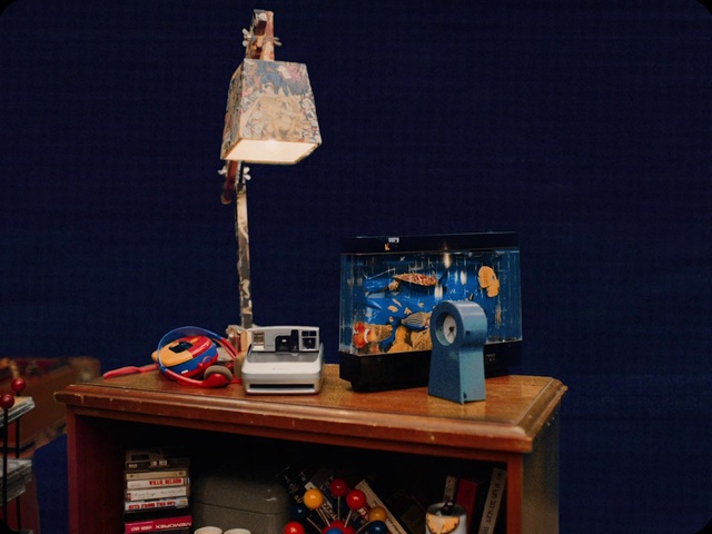 Video Reference: Table, Desk, Lamp, Shelving, Electronic device, Space, Audio equipment, Computer desk, Tower, Wood