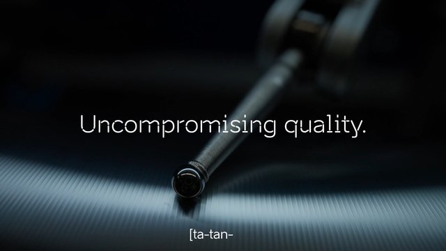 Video Reference: product, close-up, metal, sleek, dark background, macro, advertisement, text overlay, minimalist, industrial, shiny, abstract, premium, motion blur