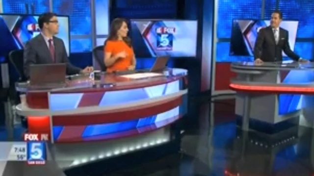 Video Reference: Clothing, Television presenter, Product, Television, Blue, Television program, Output device, News, Television set, Table