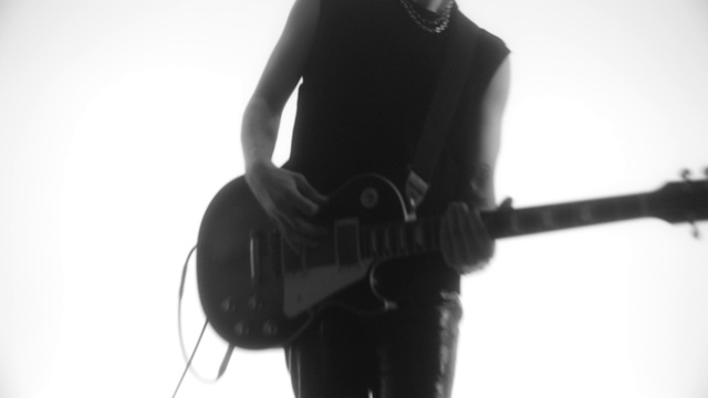 Video Reference: Hand, Musical instrument, Arm, Shoulder, Guitar, Guitar accessory, Neck, Sleeve, String instrument, Flash photography