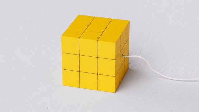 Video Reference: yellow cube, blocks, cube, white cable, plugged in, minimalist, abstract, object, 3d shape, studio background, white surface, geometry, close-up