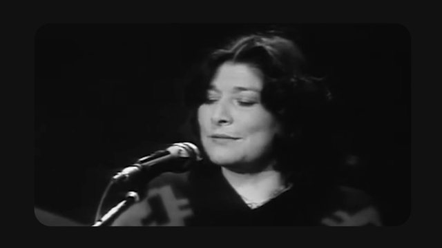 Video Reference: Microphone, Flash photography, Music, Entertainment, Music artist, Performing arts, Musician, Audio equipment, Microphone stand, Public address system