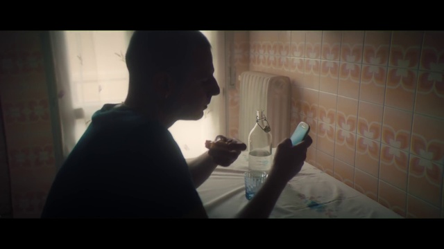 Video Reference: Arm, Mouth, Flash photography, Gesture, Tints and shades, Mobile phone, Fun, Darkness, Room, Sitting