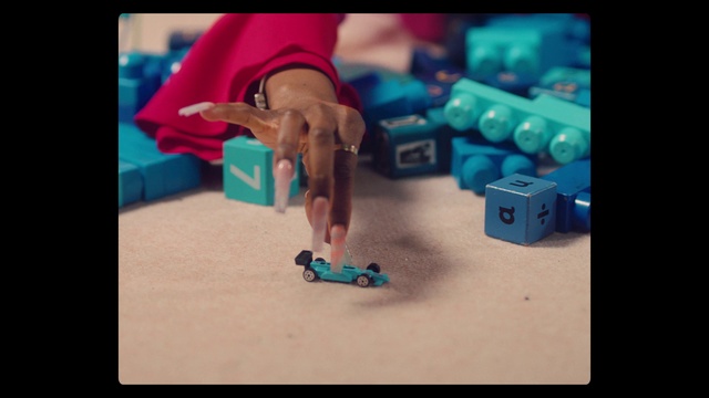 Video Reference: Hand, Azure, Gesture, Finger, Toy, Wrist, Electric blue, Nail, Thumb, Font