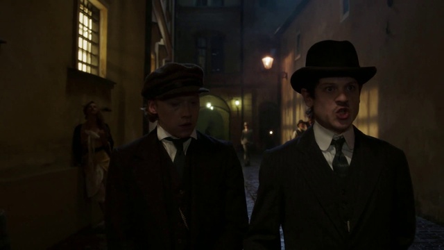 Video Reference: Hat, Window, Coat, Sun hat, Collar, Headgear, Dress shirt, Blazer, Facial hair, Formal wear