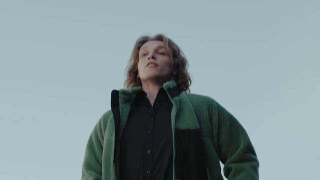 Video Reference: Hair, Face, Eye, Smile, Sleeve, Gesture, Sky, Happy, Scarf, Electric blue
