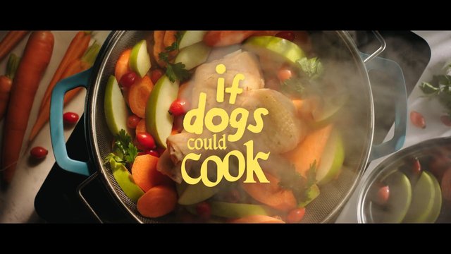 Video Reference: cooking, pot, steam, chicken, vegetables, carrots, apples, parsley, close-up, food, text overlay, recipe, kitchen, boiling, mixed vegetables, advertisement