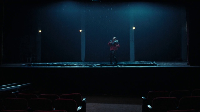 Video Reference: Entertainment, Performing arts, Stage, Chair, Music, Event, Darkness, Electric blue, Performance art, Music venue