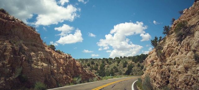 Video Reference: Cloud, Sky, Plant, Natural landscape, Road surface, Asphalt, Highland, Vegetation, Thoroughfare, Tree