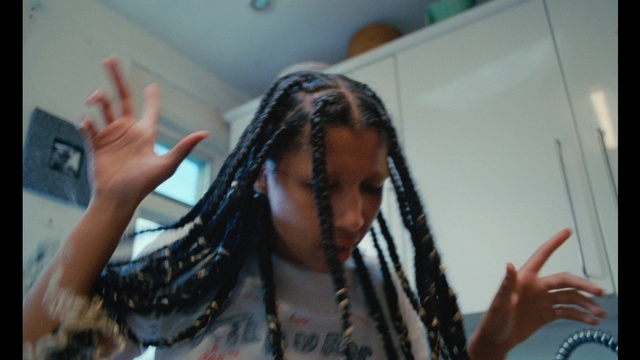 Video Reference: Cornrows, Hand, Dreadlocks, Eyelash, Gesture, Happy, Black hair, Long hair, Event, Jewellery