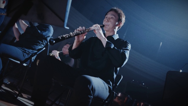 Video Reference: Microphone, Musical instrument, Musician, Guitar accessory, Entertainment, Music, Music artist, Artist, Performing arts, String instrument accessory