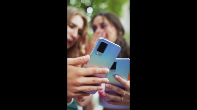 Video Reference: Smile, Mobile phone, Gadget, Communication Device, Telephony, Gesture, Portable communications device, Finger, Flash photography, Mobile device