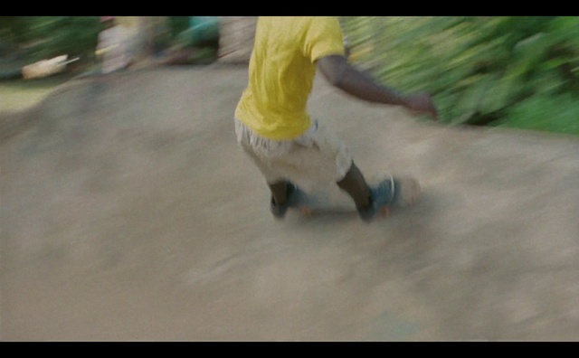 Video Reference: Asphalt, Plant, Kickflip, Shorts, Road surface, Grass, Rolling, Recreation, Skateboarder, Leisure