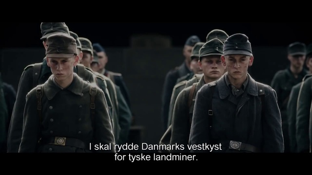 Video Reference: Hat, Peaked cap, Cap, Coat, Military person, Military uniform, Flash photography, Gesture, Fedora, Official