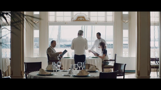 Video Reference: Table, Furniture, Window, Chair, Building, Interior design, Tableware, T-shirt, Event, White-collar worker