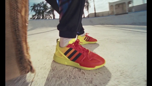 Video Reference: Footwear, Street fashion, Road surface, Asphalt, Dress, Thigh, Grey, Walking shoe, Knee, Floor