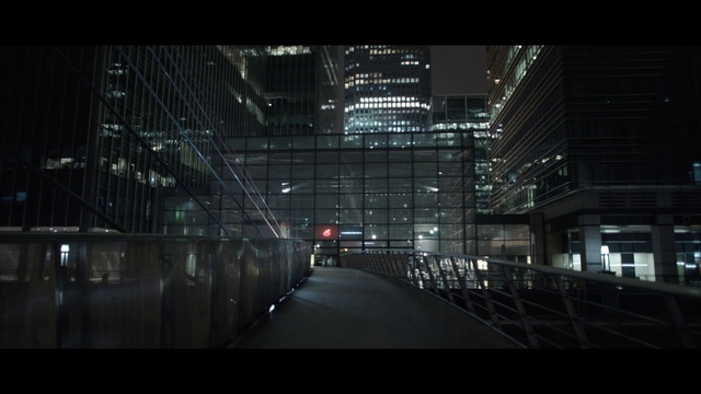 Video Reference: Building, Mode of transport, Flash photography, Electricity, City, Bridge, Metropolitan area, Tower block, Tints and shades, Symmetry
