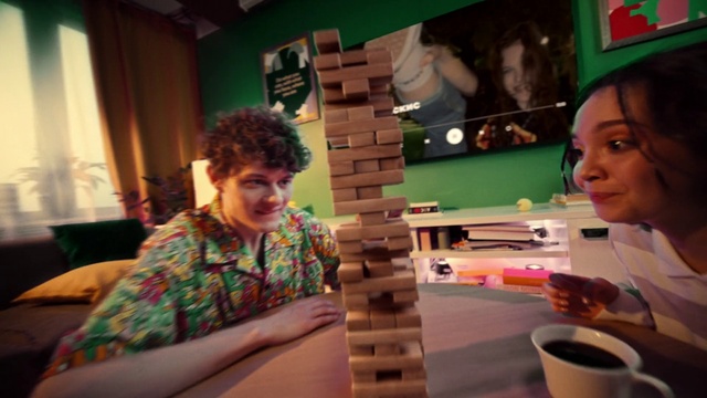 Video Reference: Smile, Tableware, Green, Curtain, Serveware, Leisure, Wood, Indoor games and sports, Event, Recreation