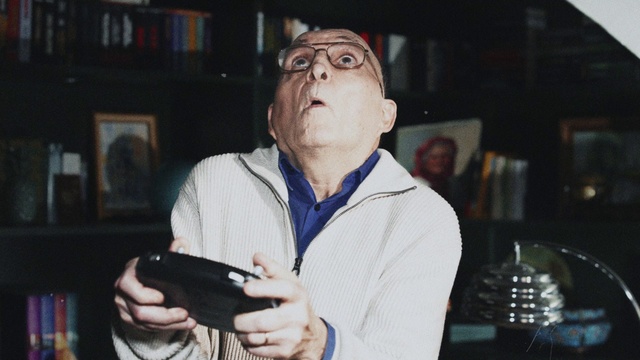 Video Reference: Glasses, Vision care, Finger, Eyewear, Photographer, Digital camera, Gadget, Reflex camera, Event, Audio equipment