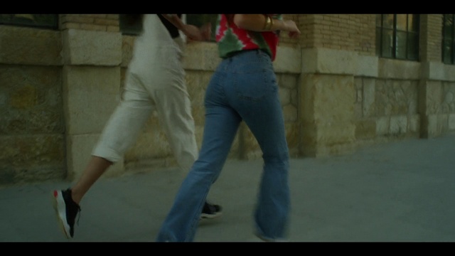 Video Reference: Jeans, Standing, Gesture, Waist, Thigh, Street fashion, Knee, Tints and shades, Denim, Sportswear