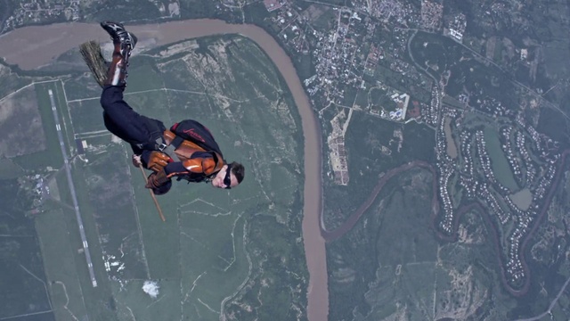 Video Reference: Tandem skydiving, Parachuting, Paragliding, Parachute, Sports equipment, Windsports, Stunt performer, Slope, Recreation, Air sports