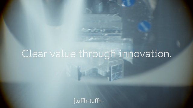 Video Reference: machinery, industrial, innovation, technology, metal, close-up, blurred, light flare, text overlay, corporate, manufacturing, mechanical, abstract, advertising