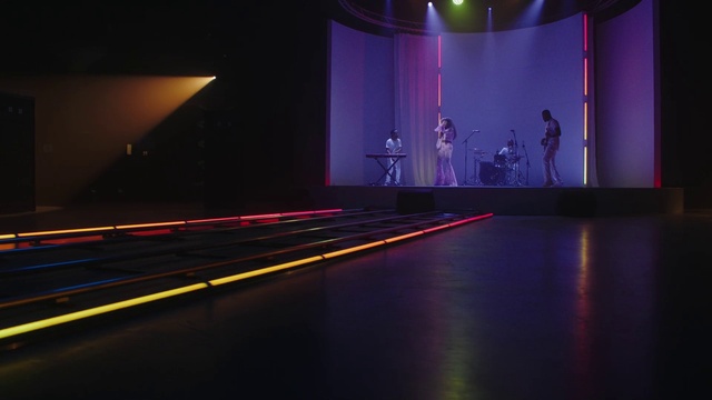 Video Reference: Light, Purple, Curtain, Entertainment, Performing arts, Visual effect lighting, Fashion design, Flooring, Magenta, Electricity