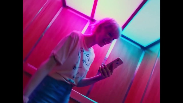 Video Reference: Arm, Purple, Violet, Entertainment, Pink, T-shirt, Magenta, Font, Performing arts, Visual effect lighting