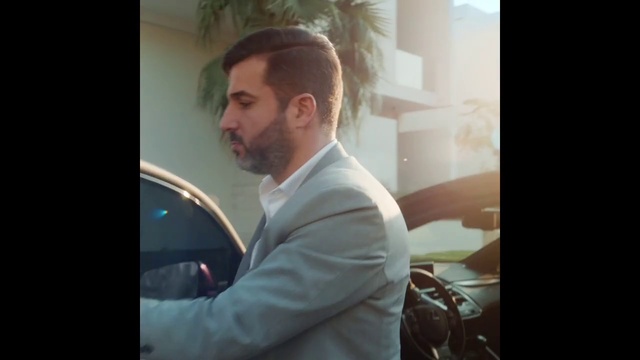 Video Reference: Flash photography, Beard, Window, Automotive design, Formal wear, White-collar worker, Event, Suit, Audio equipment, Eyewear