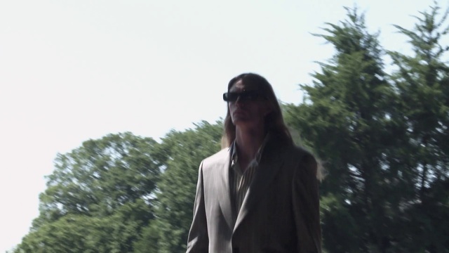 Video Reference: Sky, Sleeve, Tree, Blazer, Beak, Suit, Formal wear, Audio equipment, Conifer, Feather