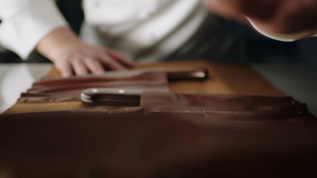 Video Reference: Musical instrument, Guitar accessory, Wood, Gesture, Finger, Automotive design, Wood stain, Table, String instrument, Flooring