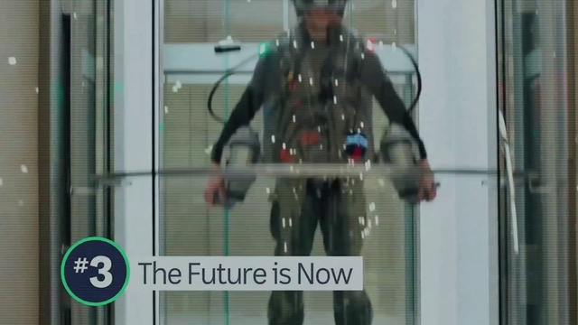 Video Reference: Sleeve, Standing, Glass, Electric blue, Toy, Belt, Personal protective equipment, Font, Fictional character, Display case