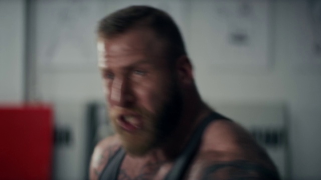 Video Reference: Forehead, Cheek, Jaw, Eyelash, Beard, Ear, Gesture, Flash photography, Facial hair, T-shirt
