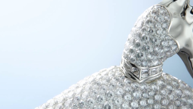 Video Reference: Outerwear, Sky, Headgear, Water, Freezing, Sculpture, Jewellery, Metal, Fashion accessory, Art