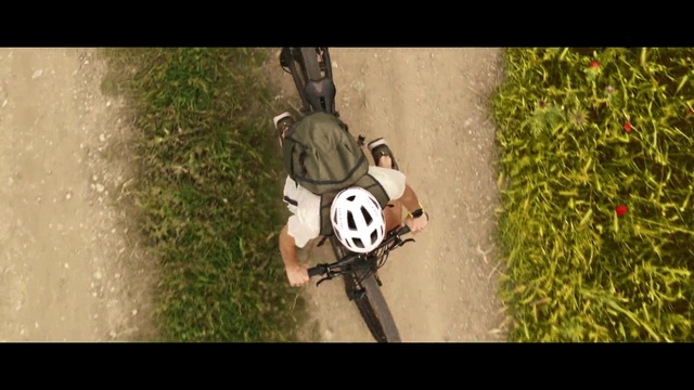 Video Reference: Helmet, Vehicle, Automotive tire, Plant, Automotive lighting, Flash photography, Tire, Grass, Motor vehicle, Sports gear